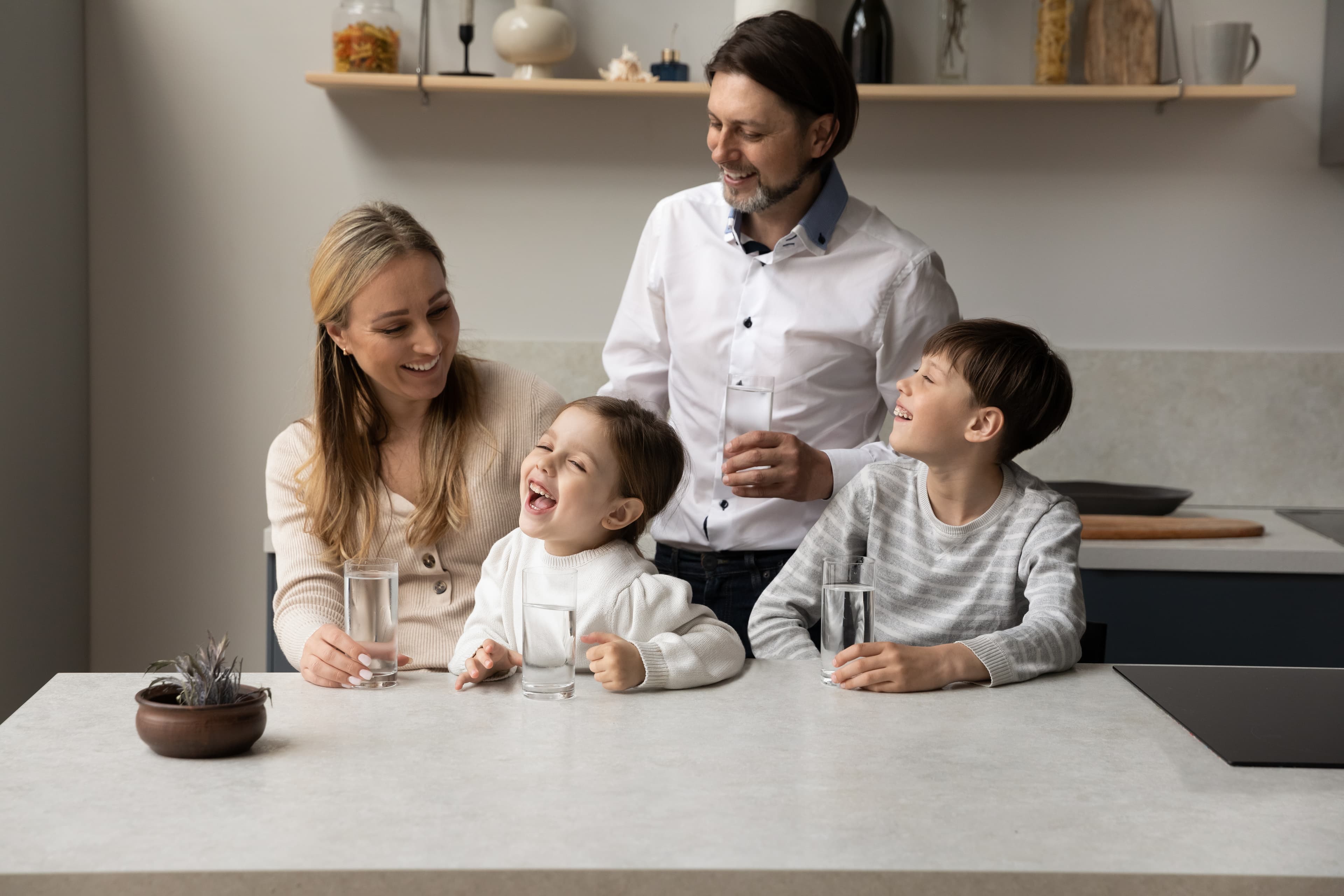 SFV family drinking filtered water at the kitchen counter